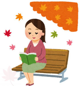 公園で読書する女性